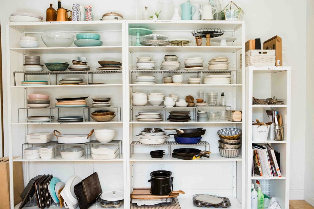 shelves organized with dishes and other things 